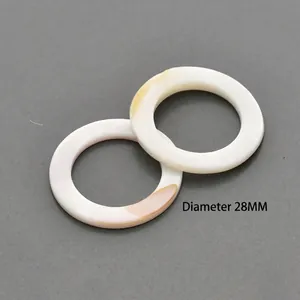 Macro view of 28mm natural white shell round rings for DIY jewelry crafting and earrings