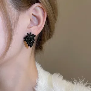 Elegant flower stud earrings with black crystals in a vintage blooming floral design