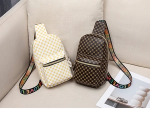 Detail of vintage polka dot sling bags in beige and brown with LOVE lettered straps