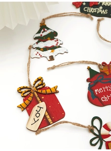Close-up of rustic 7cm wooden Christmas ornaments with red gift box and green tree shapes