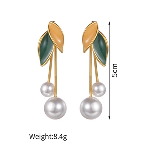 Elegant gold leaf and pearl tassel drop earrings in green and yellow enamel on white back
