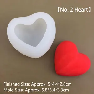 Detail of 3D heart silicone mold with finished red wax heart and size measurements