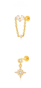 Detailed view of heart-shaped zircon and star stud earrings with gold chain