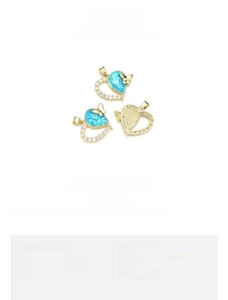 Detail view of 18K gold plated heart butterfly pendant with opal and zircon settings
