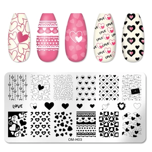 Detail view of heart and love theme nail stamping plate with finished manicure display