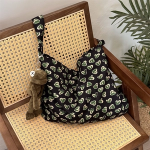 Close-up of floral cotton tote bag on vintage chair with cute frog plush accessory