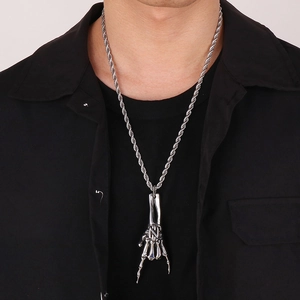 Silver skull hand gesture pendant on twisted chain necklace for men in dark rock style