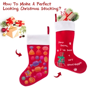 Detail of red Christmas stockings featuring festive candy patterns and dog-themed embroidery