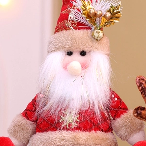 Close-up of plush Santa doll with red sequins and soft fabric for Christmas decor