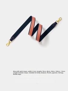 Detail of 2.5cm navy blue and orange canvas shoulder strap with gold lobster clasps