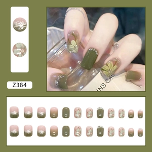Elegant camellia press-on nails with daisy patterns and pearl accents in olive and nude