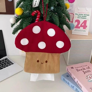 Macro detail of mushroom tissue holder in red corduroy with white polka dots