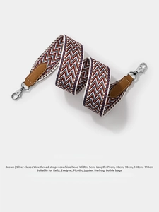 Detail of 5cm wide wax thread woven bag strap with brown cowhide and silver clasps