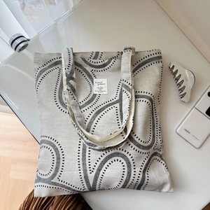 Minimalist cotton linen tote bag with abstract black print and spacious double straps