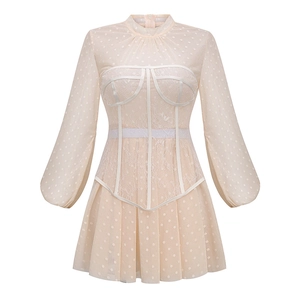 Apricot lace puff sleeve dress with polka dots and mesh detail on white background