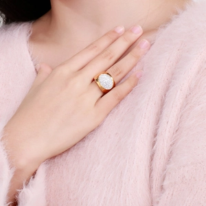 Elegant gold-plated wide band ring with sparkling crystal inlay on female hand