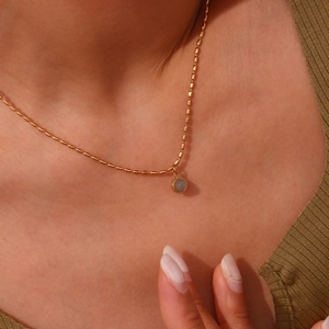 Gold-plated stainless steel chain necklace with round natural stone pendant on model
