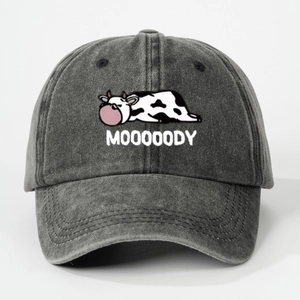 Washed dark gray baseball cap with cartoon cow blowing bubble gum and MOOOOODY text