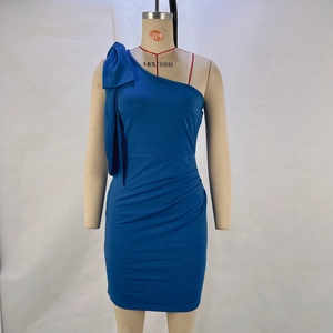 Detail of the oversized shoulder bow and ruched texture on this blue off-shoulder dress
