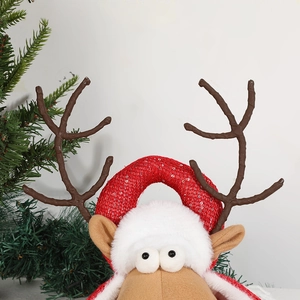 Christmas reindeer doll decoration with brown antlers and red sequin hat for holiday decor