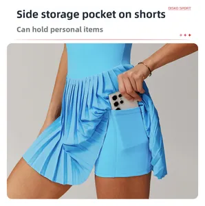 Macro detail of sky blue pleated tennis skirt showing hidden side pocket for phone storage