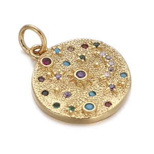 Close-up of gold star and moon compass pendant with colorful inlaid zircon gemstones