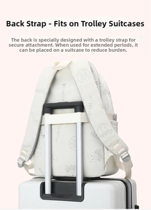 Detail of the back luggage strap on a cream school backpack for easy travel attachment