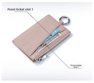 Detail view of lychee grain leather wallet with card slots and silver zipper in rose pink