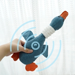 Detailed close-up of blue corduroy squeaky duck pet toy with interactive cotton rope