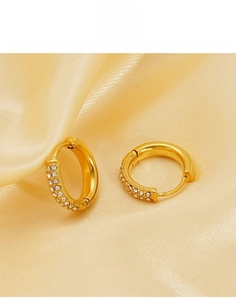 Detail of 18K gold-plated titanium steel hoop earrings featuring micro-pave white zircon