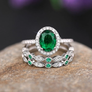 Luxury 3-piece set with emerald green oval gemstone and marquise hollow diamond rings