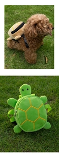 Detail of plush turtle-shaped dog backpack with adjustable straps and zipper closure