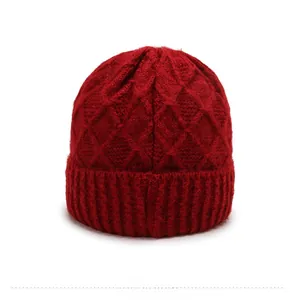 Rear view of thick red cable-knit hat for elderly women with textured diamond pattern