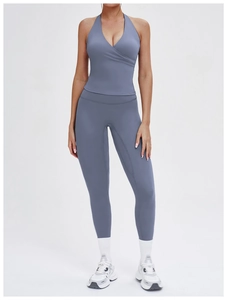 Front view of grey-blue yoga set featuring halter neck top and high-waist leggings