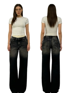 Front and back detail of high-waisted black-grey gradient wide-leg denim jeans