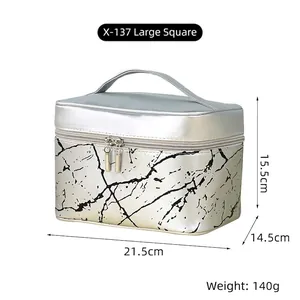 Silver marble pattern cosmetic bag detail with dual zippers and handle size dimensions