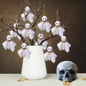 Set of 16 white ghost hanging ornaments on dry branches with skull Halloween decor