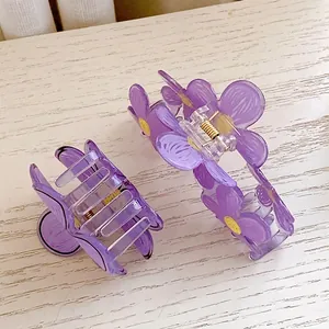 Purple flower hair claw clip set with translucent resin petals and yellow stamens