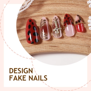 French leopard and cherry press-on nails with dark red finish and metal cross charms