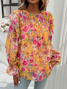 Detailed view of yellow floral print shirt with pleated chest and ruffle cuffs for women
