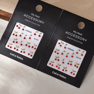 Cute red cherry nail art stickers with K9 crystal rhinestones and gold leaf accents