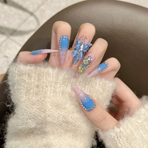 Long stiletto press-on nails with blue-pink gradient, 3D butterflies and crystals
