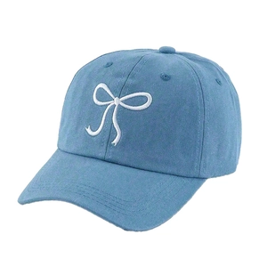 Light blue cotton baseball cap featuring elegant white ribbon bow embroidery on the front