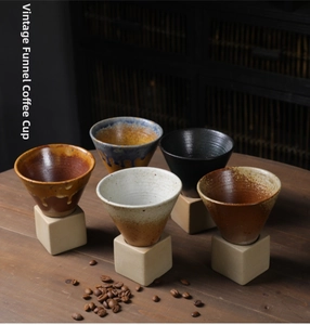 Set of retro funnel-shaped ceramic coffee cups with square clay bases in diverse glaze finishes