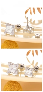 Macro view of zircon stud earrings with screw back design and silver plated finish