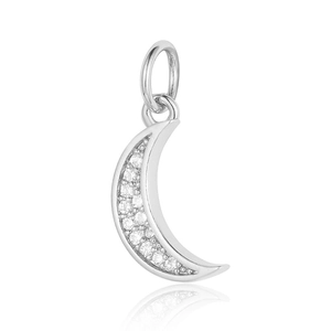 Macro detail of crescent moon copper zircon pendant with sparkling clear stones