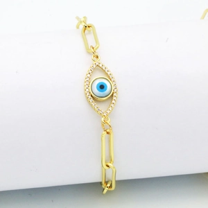 Golden paperclip chain bracelet with a sparkling crystal evil eye charm pendant