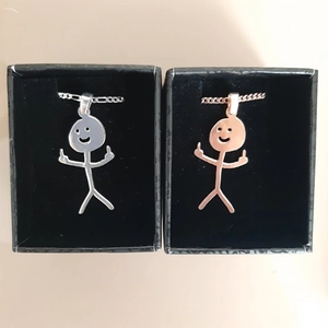 Funny doodle middle finger necklaces in silver and rose gold with black gift boxes