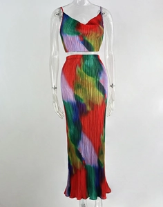 Detail of colorful pleated two-piece set featuring abstract print and organza texture