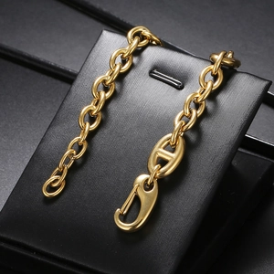 Minimalist gold stainless steel Cuban chain bracelet with H-link design on display